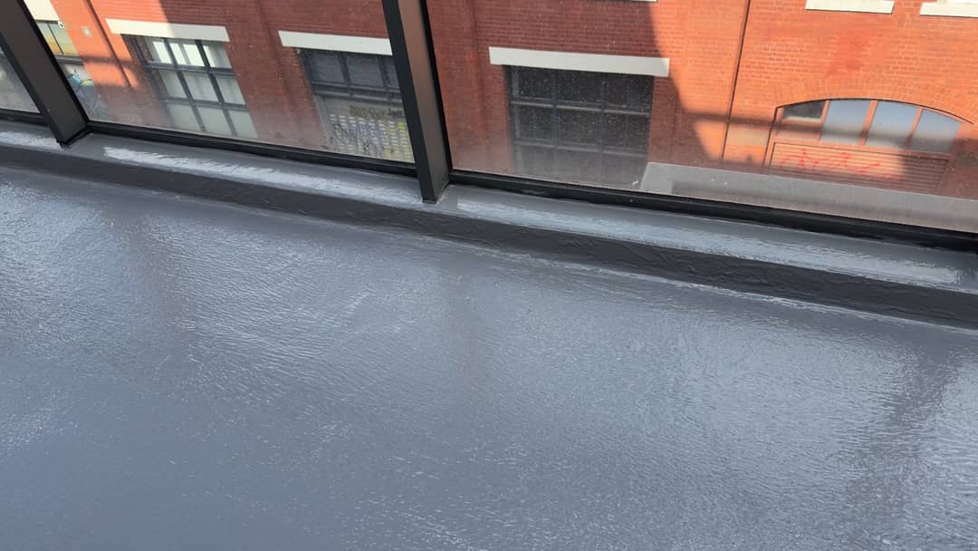 New waterproofing membrane applied to a balcony before concrete repair, screeding and re-tiling by one team