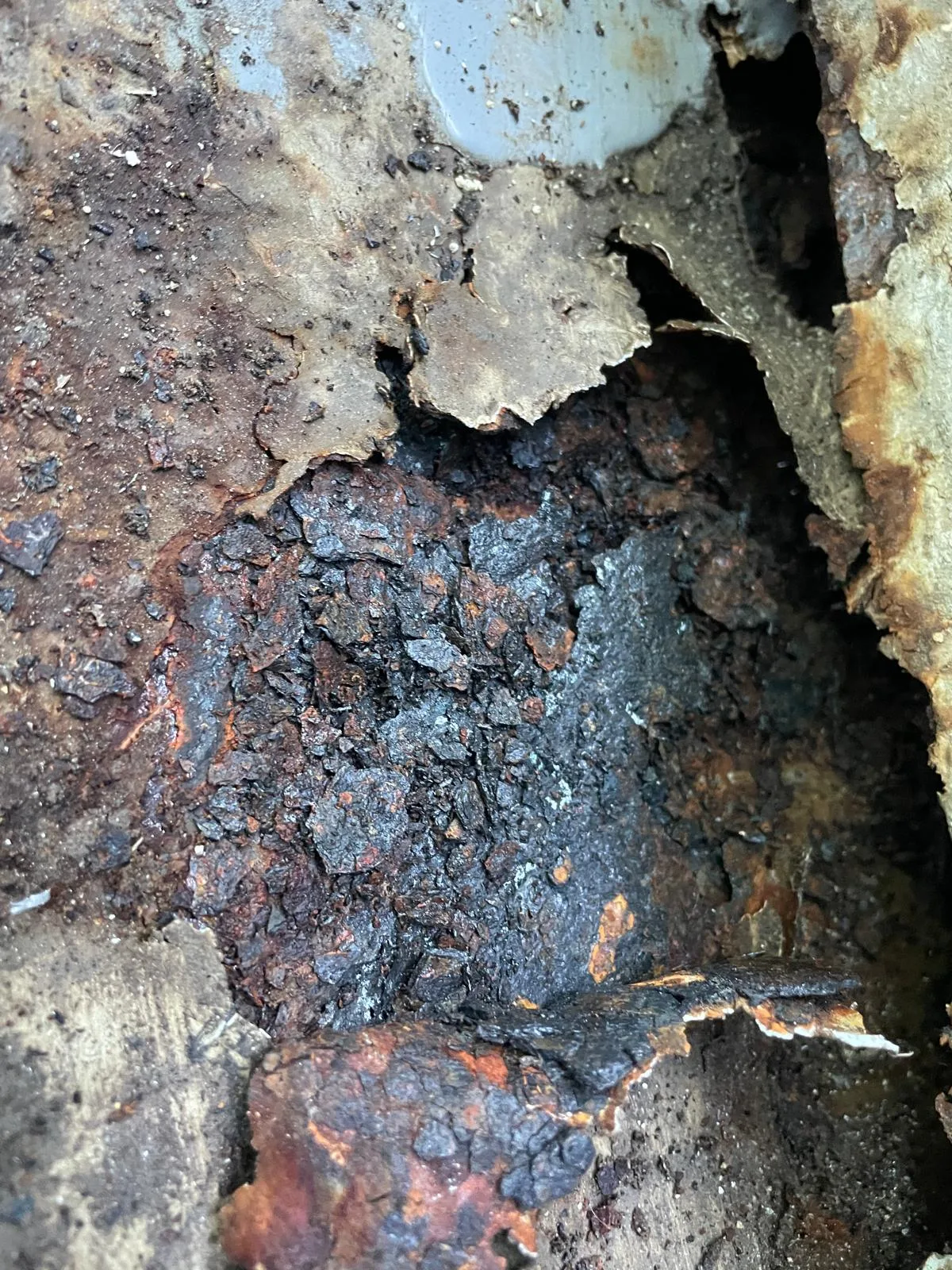 Corroded junction where the cladding met the balcony slab