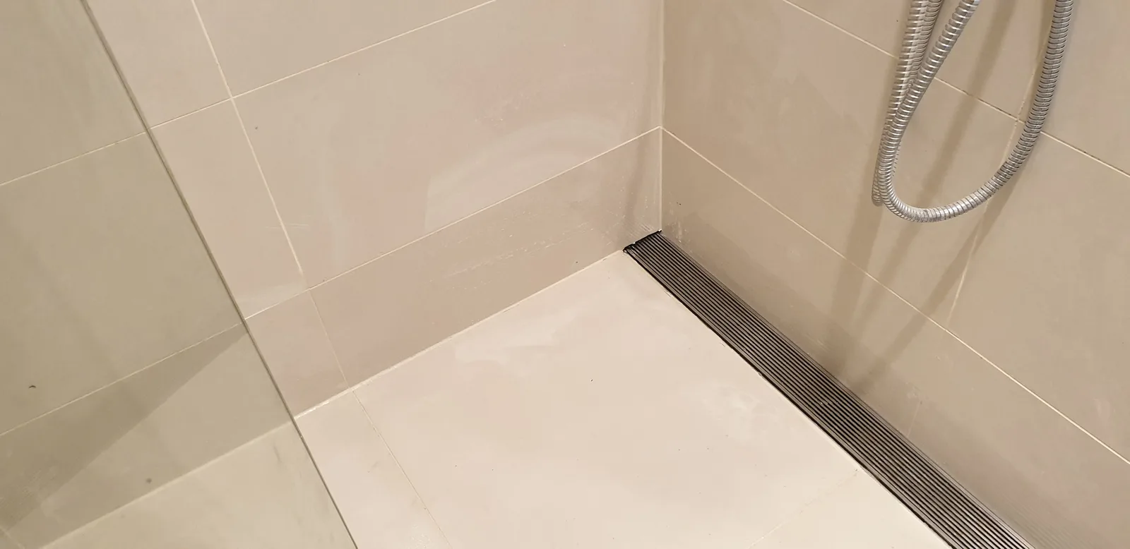 The completed threshold detail with the linear drain in place